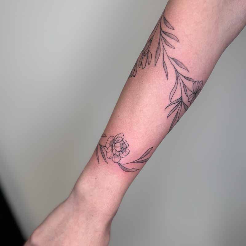 Tak rondom arm tattoo